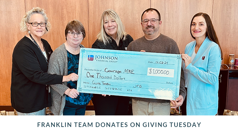 Franklin branch associates holding a large check