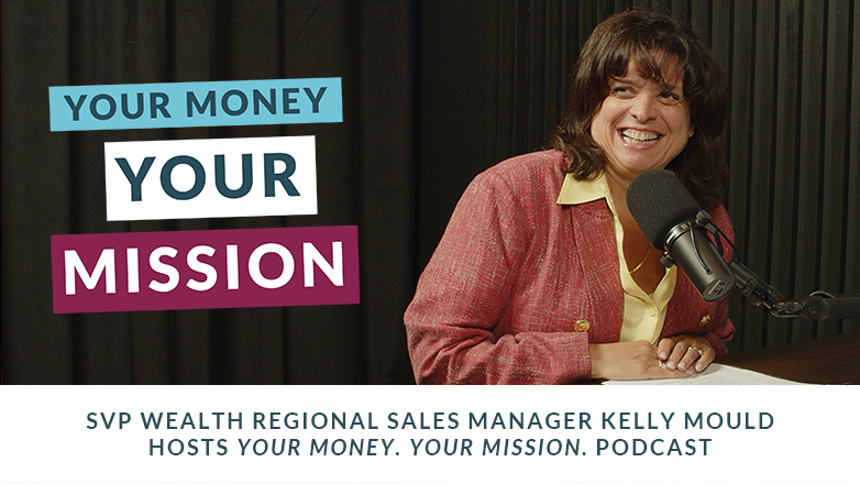 Kelly Mould smiling with the podcast microphone.